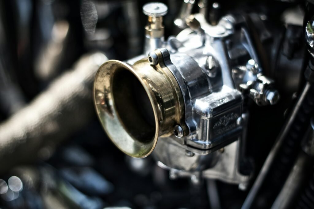 pexels-photo-1410448-1410448 Detailed shot of a motorcycle engine component showcasing metallic textures.